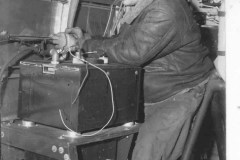 TSgts DF Buskin - repairing radio